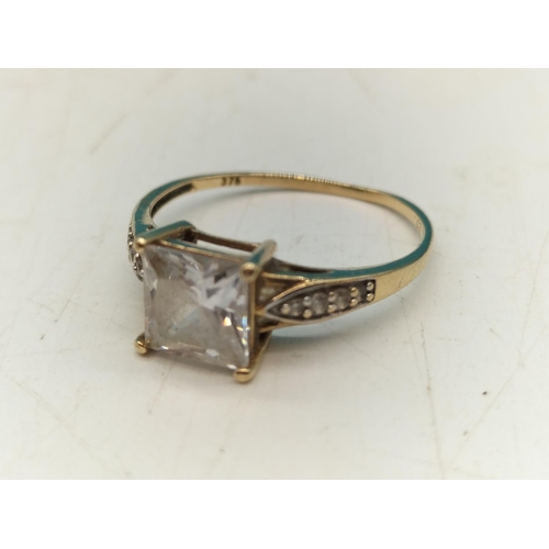 212 - 9ct Gold Ring. Size K. 1.3 Grams including Stones.