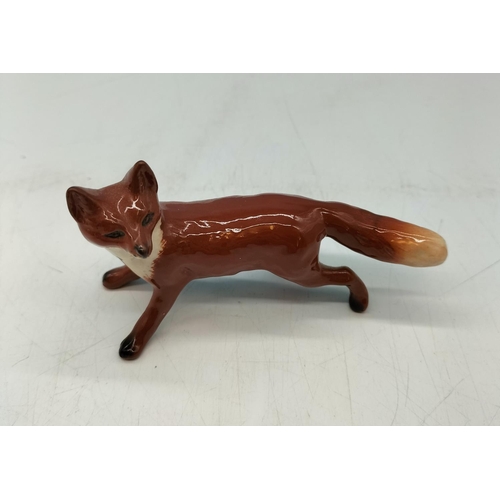 216 - Beswick Figure of a Fox. 10cm x 6cm.