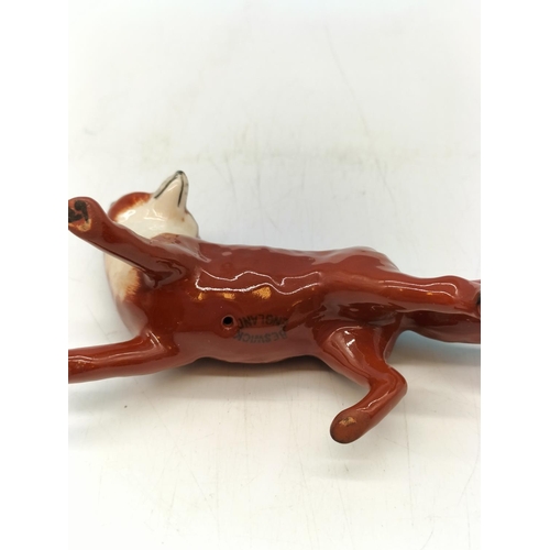 216 - Beswick Figure of a Fox. 10cm x 6cm.