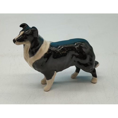 217 - Beswick Figure of a Collie Dog with Gold Stamp. 11cm x 8cm.