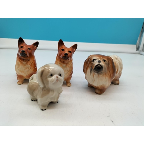 367 - Pottery Dog Figures (4). Largest being 12cm x 9cm.