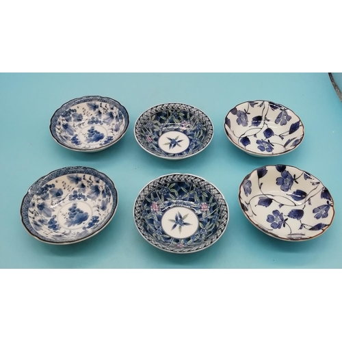 706 - 20th Century Japanese Blue and White Floral Bowls (6). Differing Character Marks. 11cm Diameter.