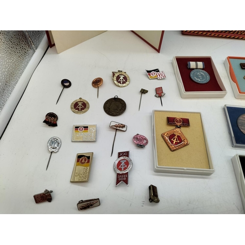 47 - Large Collection of German DDR Awards and Medals complete with Certificates and Other Ephemera. (Pre... 