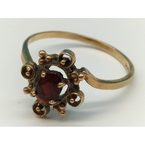 28 - 9ct Gold and Red Stone set Ring. Size R. 2 Grams.