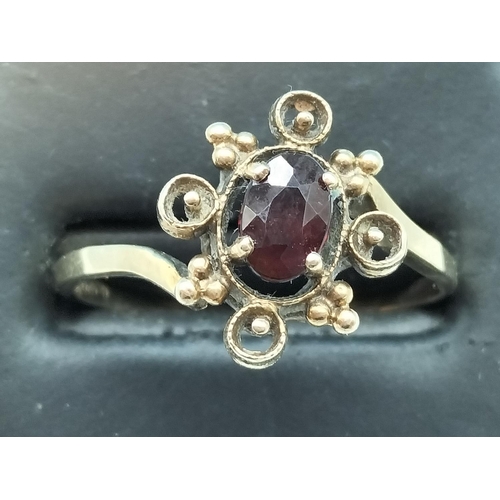 28 - 9ct Gold and Red Stone set Ring. Size R. 2 Grams.