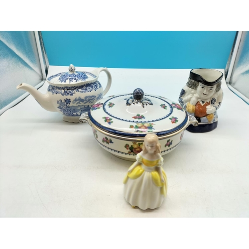 438 - Royal Doulton 'Penny' Figure HN2424, Woods Blue and White Teapot, Toby Jug and Booth's Lidded Circul... 