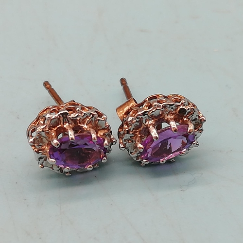 58 - 9ct Gold Amethyst and Diamond set Earrings.