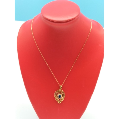 38 - 9ct Gold Chain and Stone Set Pendant. 4.6 Grams.