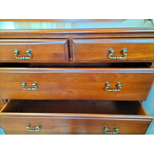 85A - Wooden Chest of 7 Drawers with Brass Handles on Bun Feet. 77cm high, 142cm x 49cm. Collection Only.