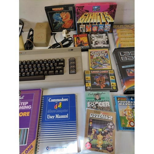 89 - Commodore 64 with Joysticks and Games. Cover Missing on Tape Deck. Powers Up.