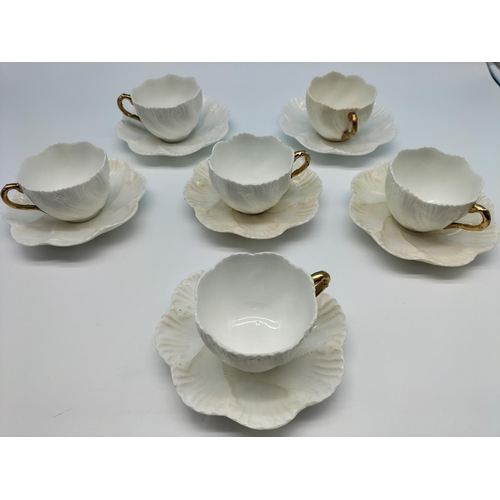 74 - Coalport Creamware Gold Handled Cups and Saucers (6). Backstamp for 1891-1919. 1 Saucer A/F.