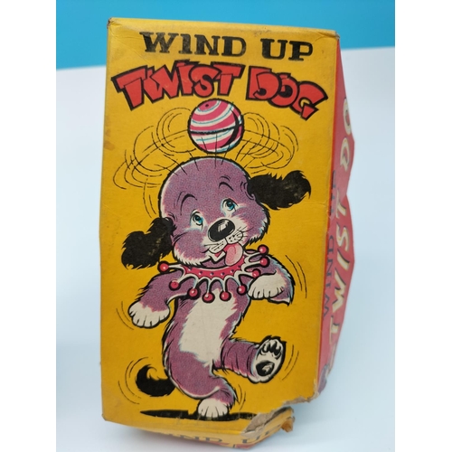 76 - Vintage Wind Up Twist Dog with Part Box. W/O.