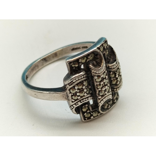 58 - 925 Silver and Marcasite Ring. Size O. 5.6 Grams.