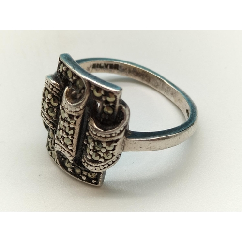 58 - 925 Silver and Marcasite Ring. Size O. 5.6 Grams.