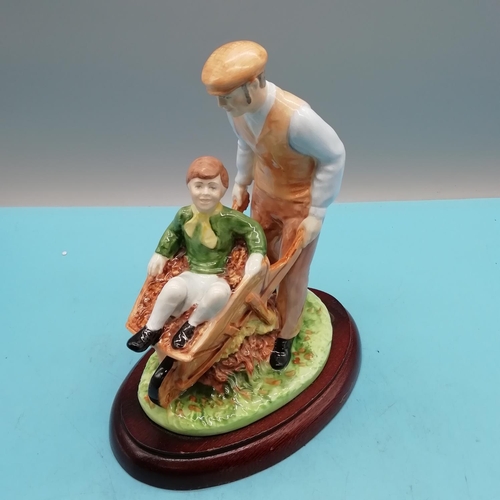 185 - Coalport 20cm Figure of a Child in Wheelbarrow.