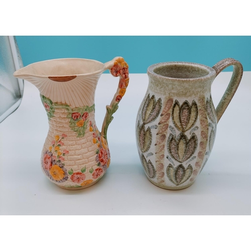 406 - 1930's Arthur Wood 21cm Jug plus a Denby Jug.