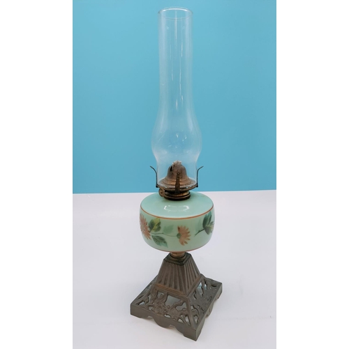 408 - Victorian Oil Lamp with Milk Glass Hand Painted Floral Body and Cast Metal Base. Overall Size 48cm.