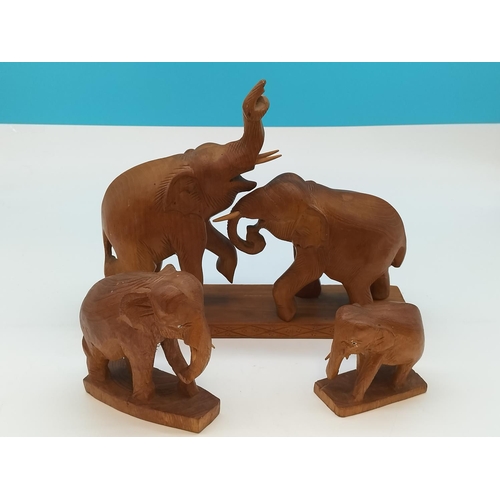 451 - Wooden Elephant Figures (3). Largest being 30cm x 24cm.