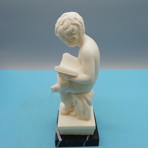 529 - Italian Resin/Composite 'Reading Boy' Bookend on Black Marble Base. 16cm High.