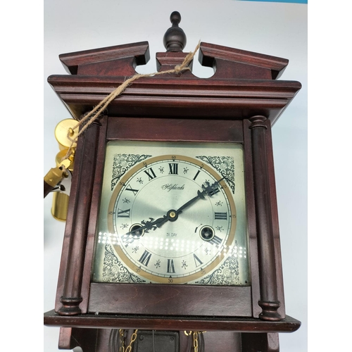 597 - Wind Up Wall Clock with Key, Pendulum and Weights. W/O. 54cm x 25cm.