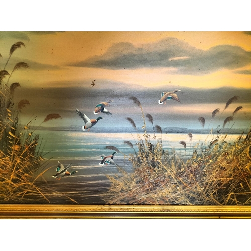 606 - Large Ornate Framed Oil on Canvas 'Mallards Rising' with Signature. 118cm x 68cm. Collection Only.