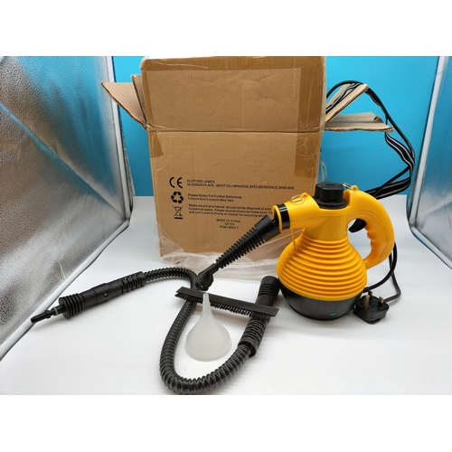 699 - Boxed Steam Cleaner Model KB-2009. W/O.