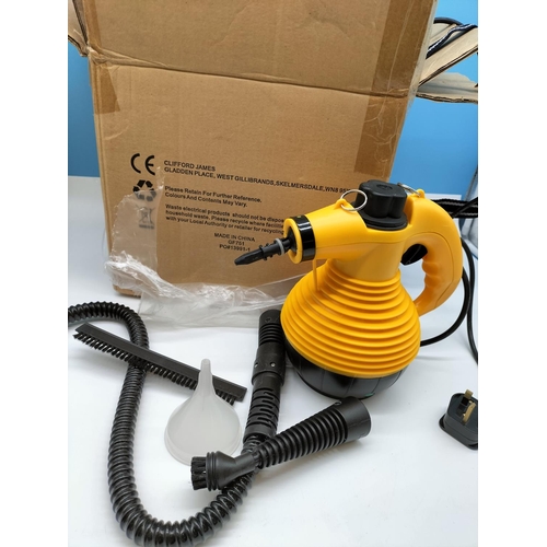 699 - Boxed Steam Cleaner Model KB-2009. W/O.