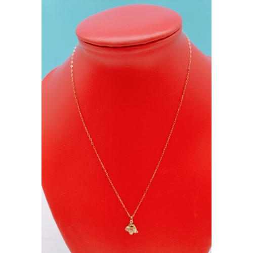 88 - 9ct Gold Necklace with Teddy Pendant.