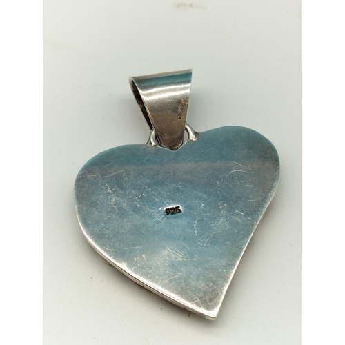 225 - Silver and Gemstone Heart Shaped Pendant. 34.5 Grams.