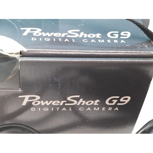 112 - Canon Powershot G9 with Accessories. In Original Box.