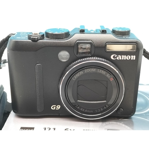 112 - Canon Powershot G9 with Accessories. In Original Box.