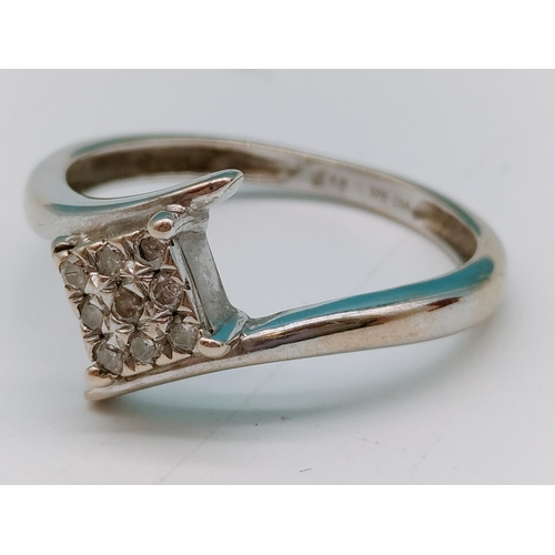 289 - 9ct White Gold and Diamond Ladies Ring. Size J. 1.4 Grams.