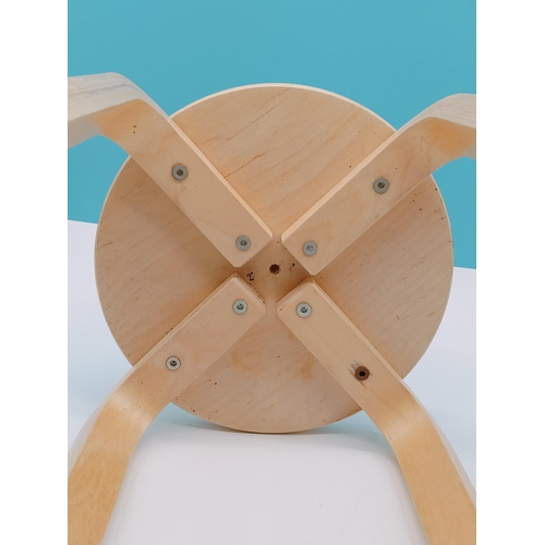 576 - Childs Light Wood Stool. 30cm High, Diameter to include Legs 34cm.