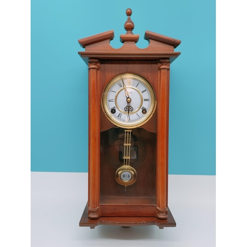 590 - Wall Clock by Highlands, with Key. 49cm Tall.