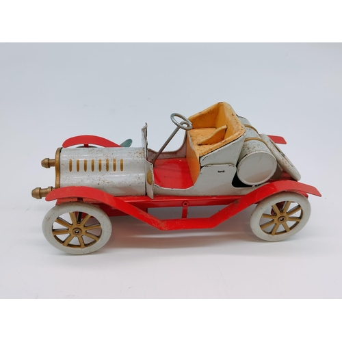 604 - Vintage Tin Toy Car with Key. 18cm Long.