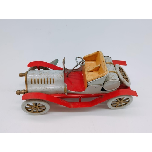 604 - Vintage Tin Toy Car with Key. 18cm Long.