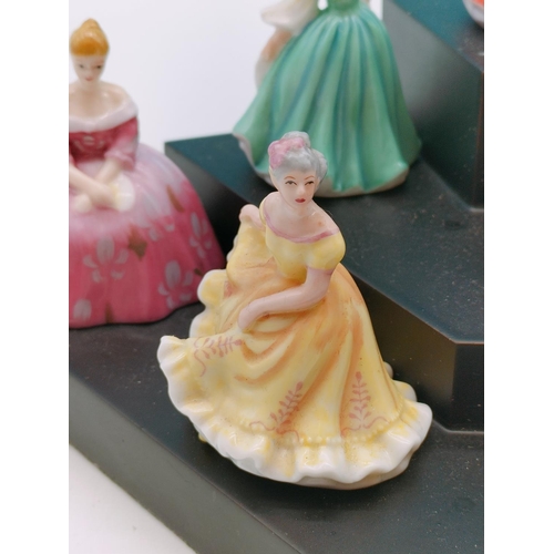 562 - 9 x Royal Doulton Minature Ladies on Stand.