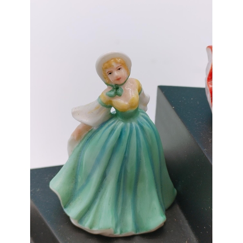 562 - 9 x Royal Doulton Minature Ladies on Stand.