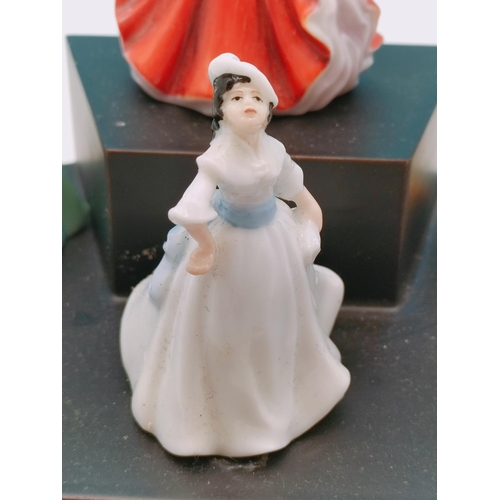 562 - 9 x Royal Doulton Minature Ladies on Stand.