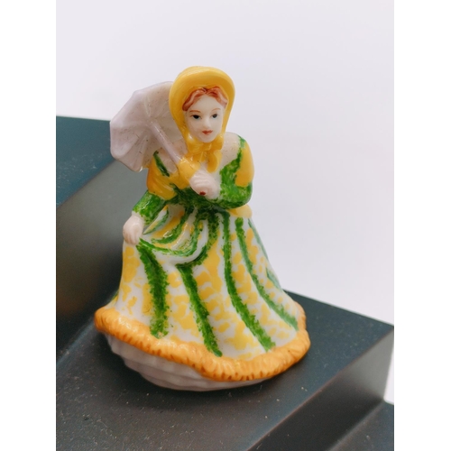 562 - 9 x Royal Doulton Minature Ladies on Stand.