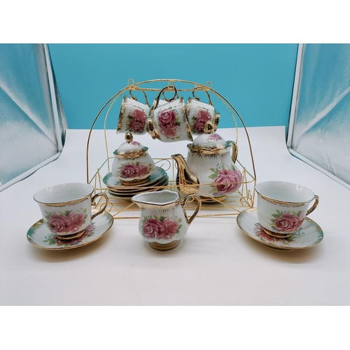 394 - Fine Porcelain 15 Piece Tea Set with a Rose Design plus Stand.