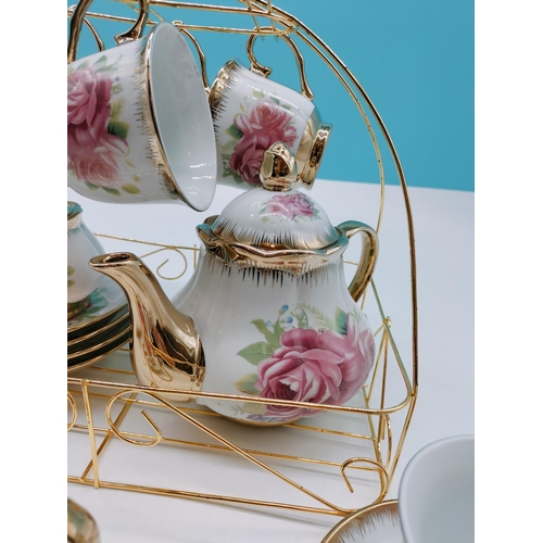 394 - Fine Porcelain 15 Piece Tea Set with a Rose Design plus Stand.