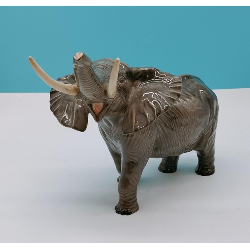 218 - Large Beswick Figure of an Elephant. Repair to 1 Tusk. 26cm High x 31cm.