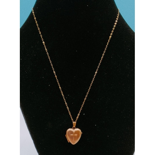 398 - 9ct Gold Heart Locket with Cross Design on 9ct Chain. 1.5 Gram.