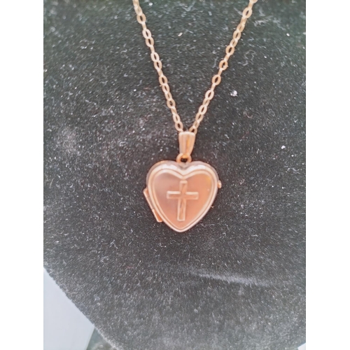 398 - 9ct Gold Heart Locket with Cross Design on 9ct Chain. 1.5 Gram.