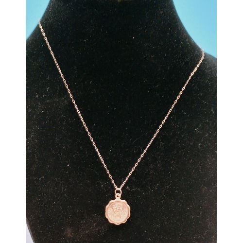 403 - 9ct Gold Chain with Gold Tone Pendant.