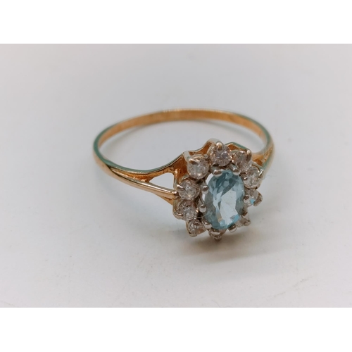 405 - 9ct Gold Ring with Aquamarine and Cubic Zirconia. 1.6 Grams. Size O+