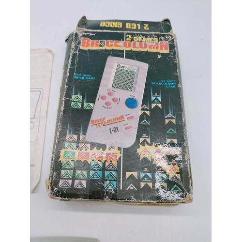 410 - Boxed Vintage Brick Kolum 2 in 1 Hand Held Game.