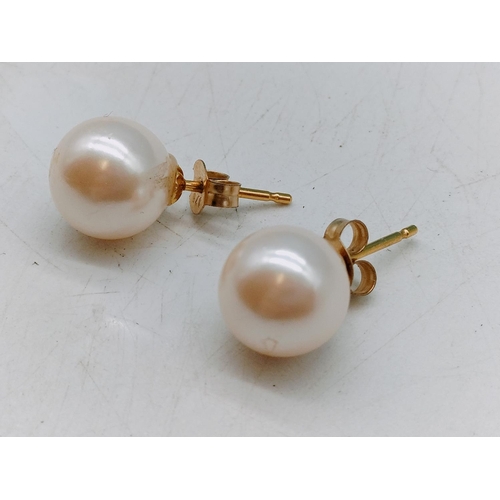 464 - Pair of 375 Pearl Earrings.