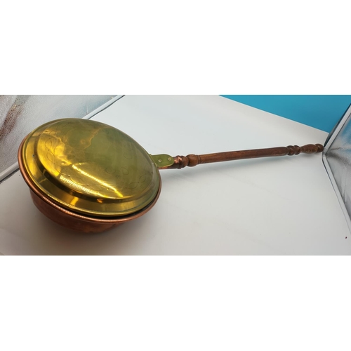 320 - Brass and Copper Bed Warming Pan. 101cm Long, 31cm Diameter. Collection Only.